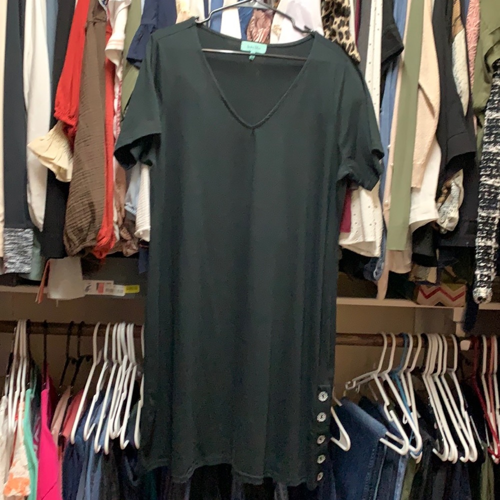 Black dress with buttons on one bottom side.